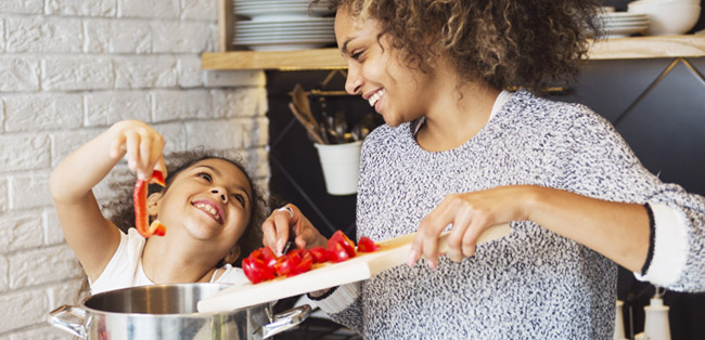 mother and child cooking together